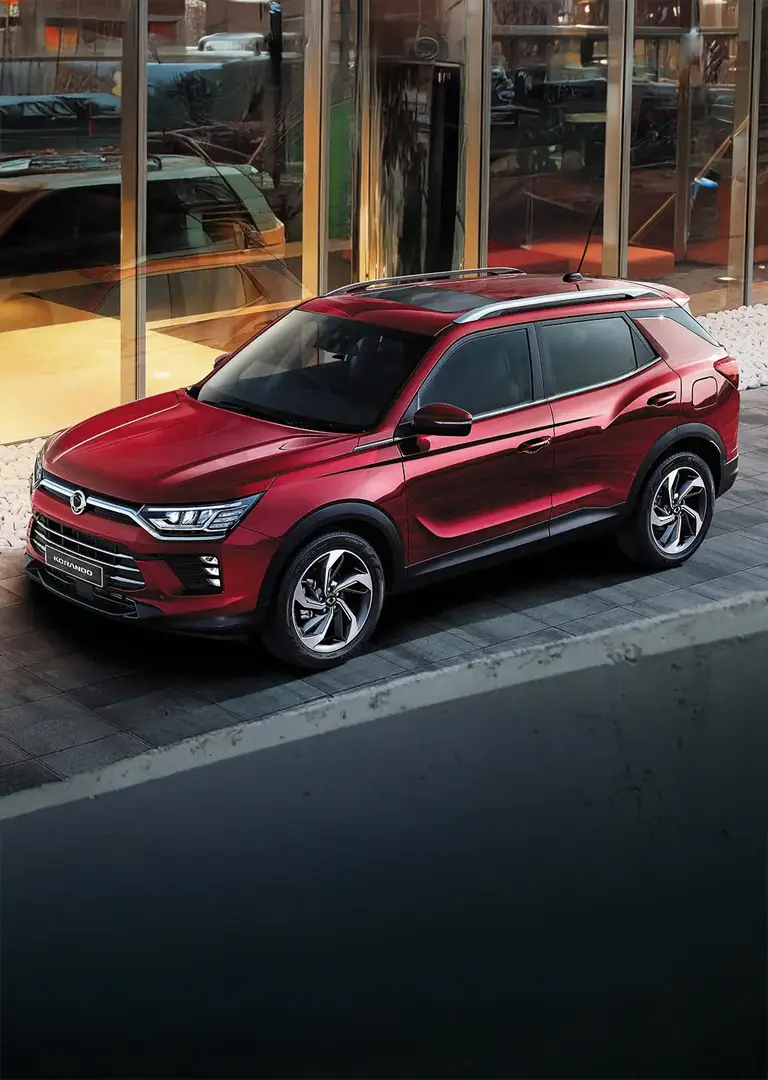 Red korando vehicle parked